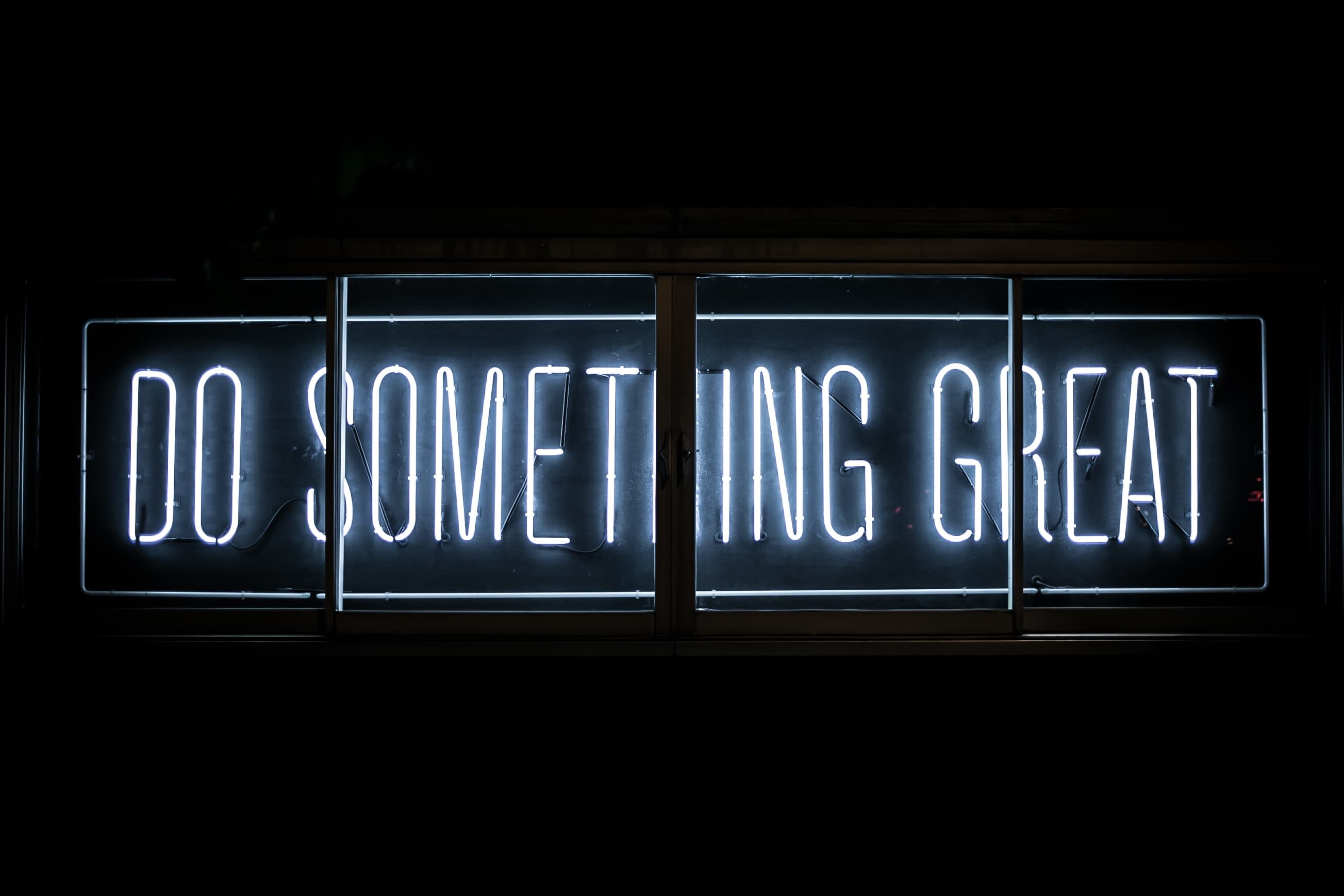 a neon sign on a wall.