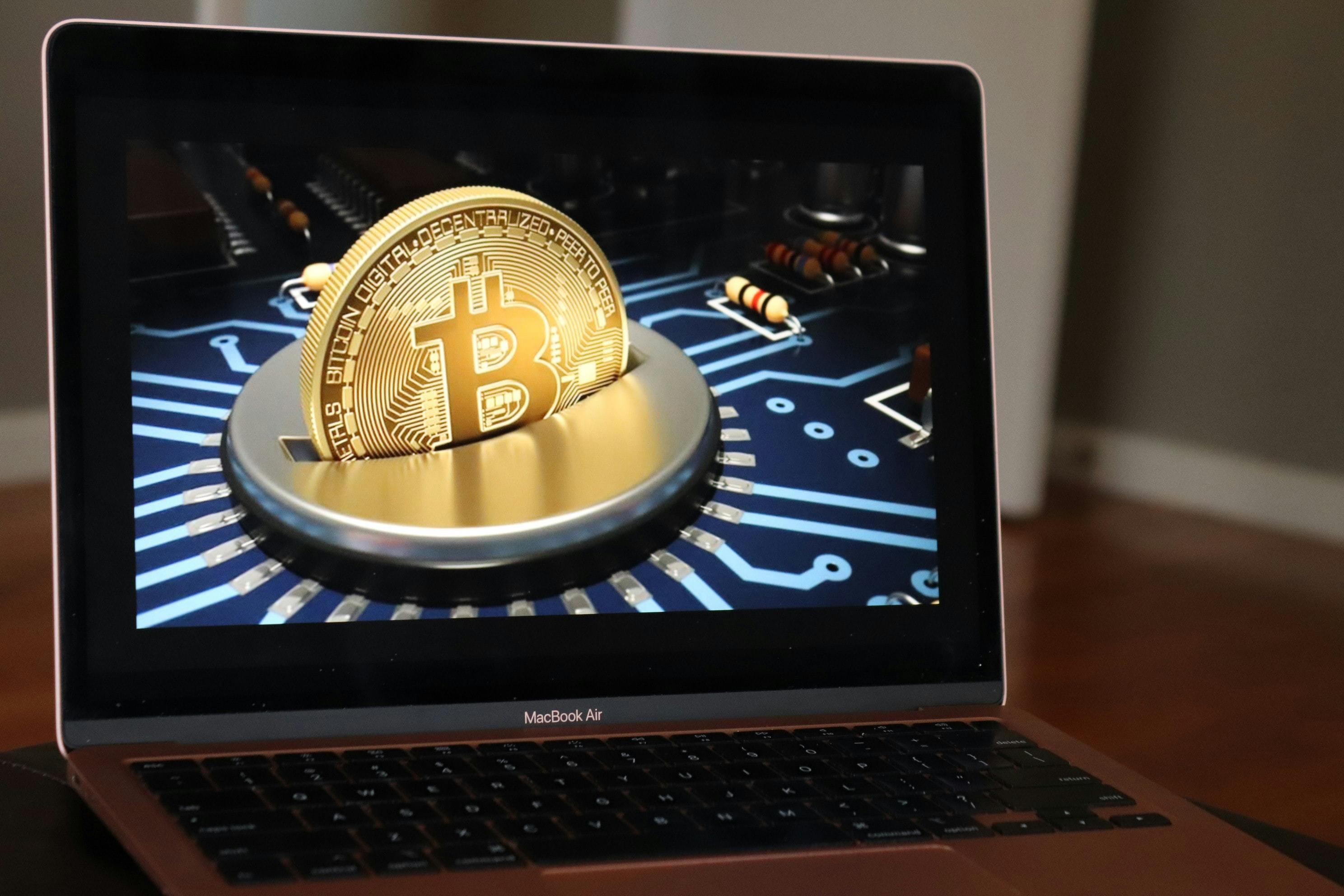 the laptop with the gold coin.