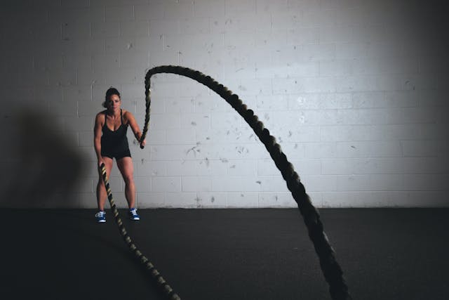 A woman is engaged in a jump rope.