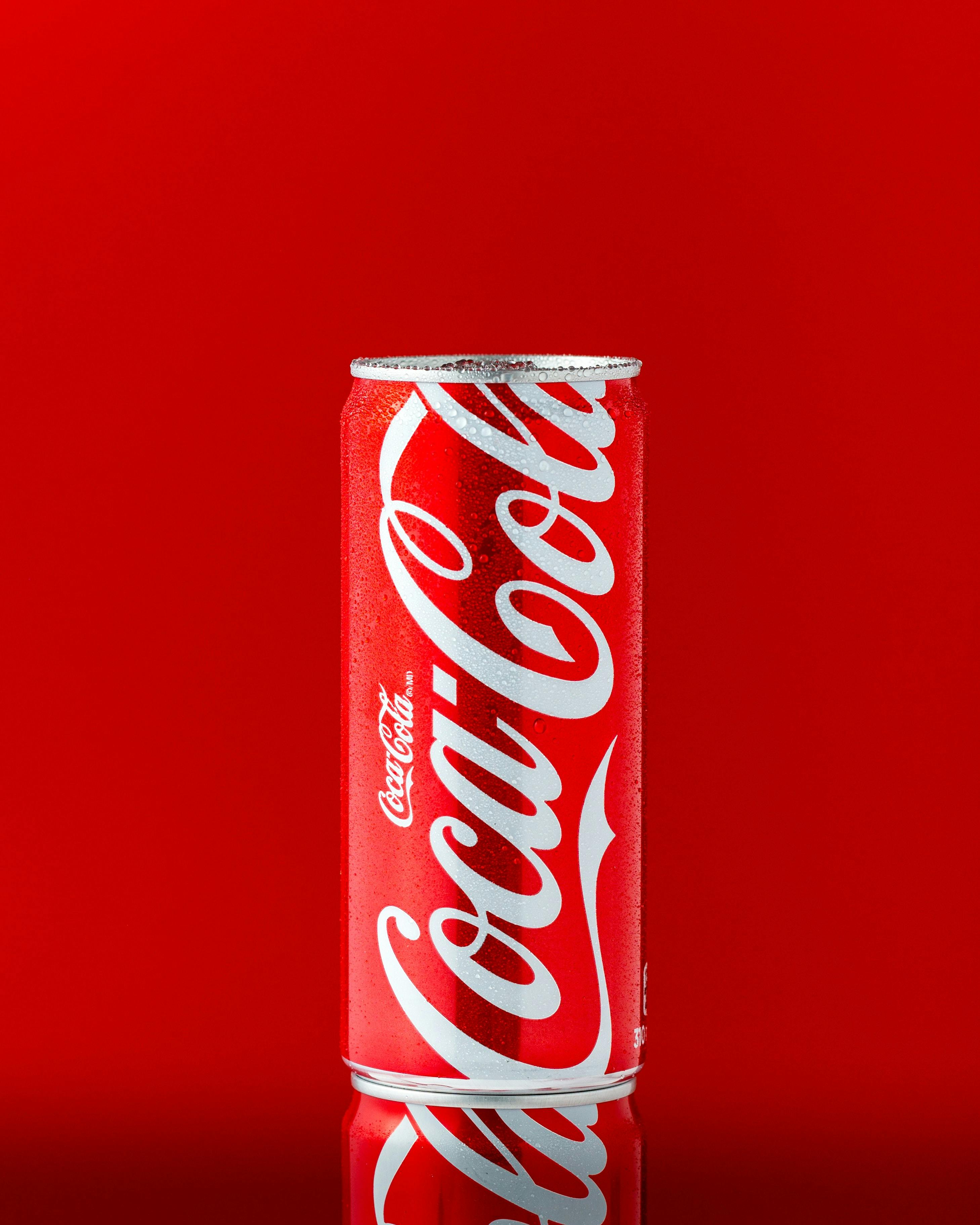 a bottle of brand on red background.