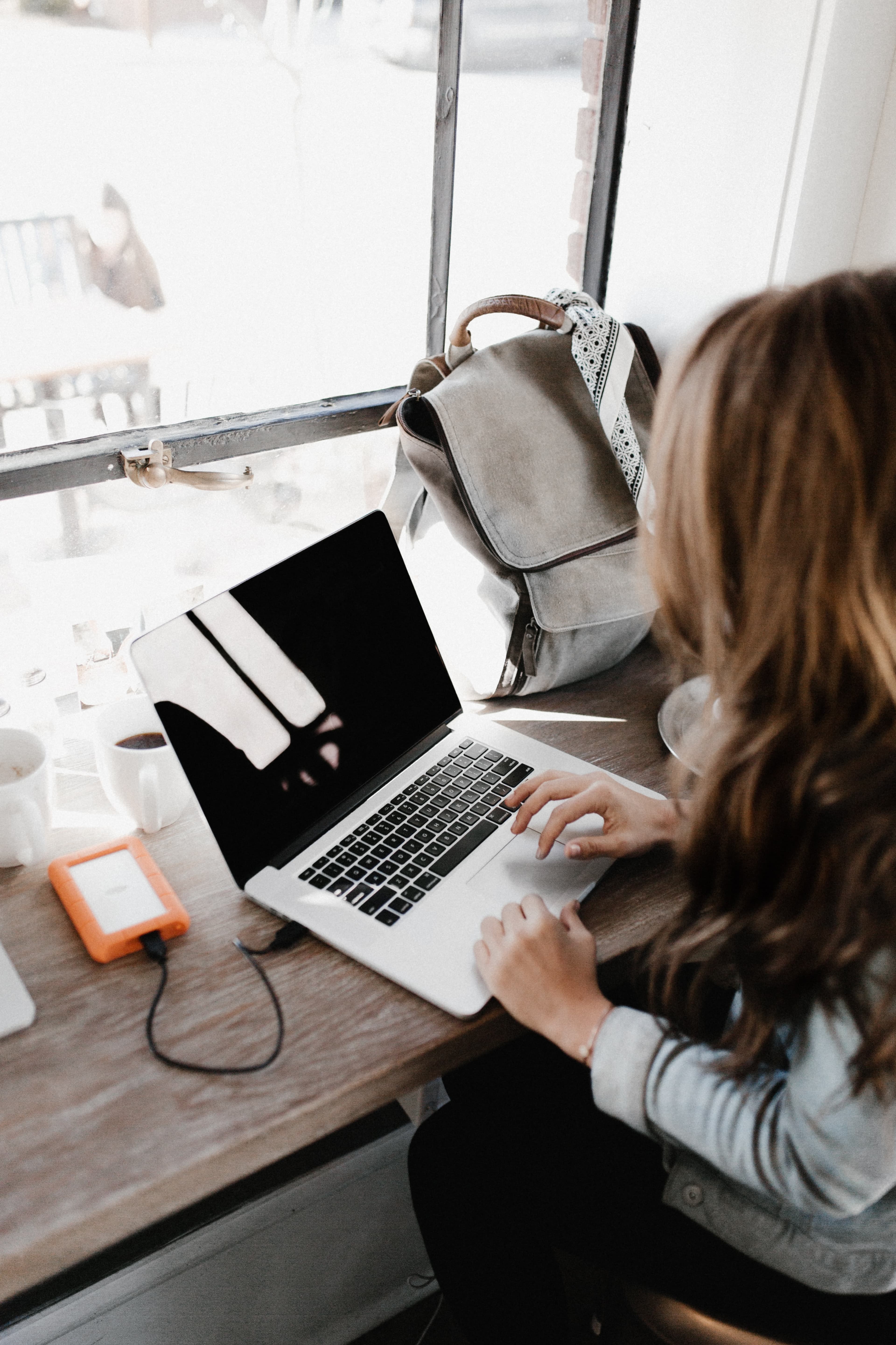 a woman working on a laptop.